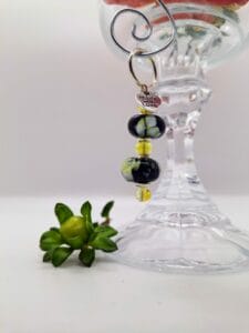 Black with ivory flowers dangly doodad