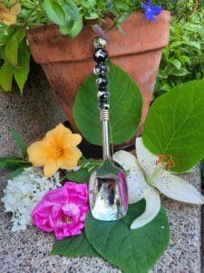 Black with silver foil serving spoon