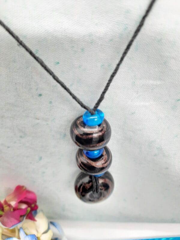 Black with gold swirls and aqua spacers tactile - necklace