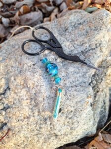 Black embroidery scissors with aqua turquoise and silver dots