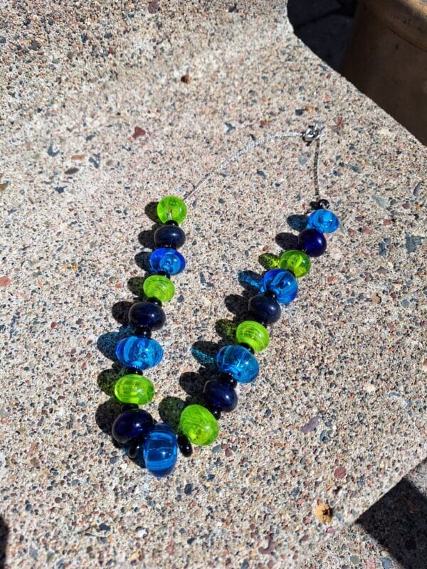 Blues and greens hollows necklace