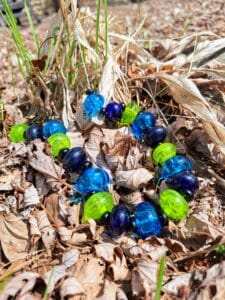 Blues and greens hollows with black necklace