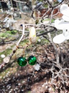 Emerald green on medium gold hoops