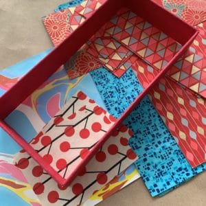 Brightly colored papers arranged on a table