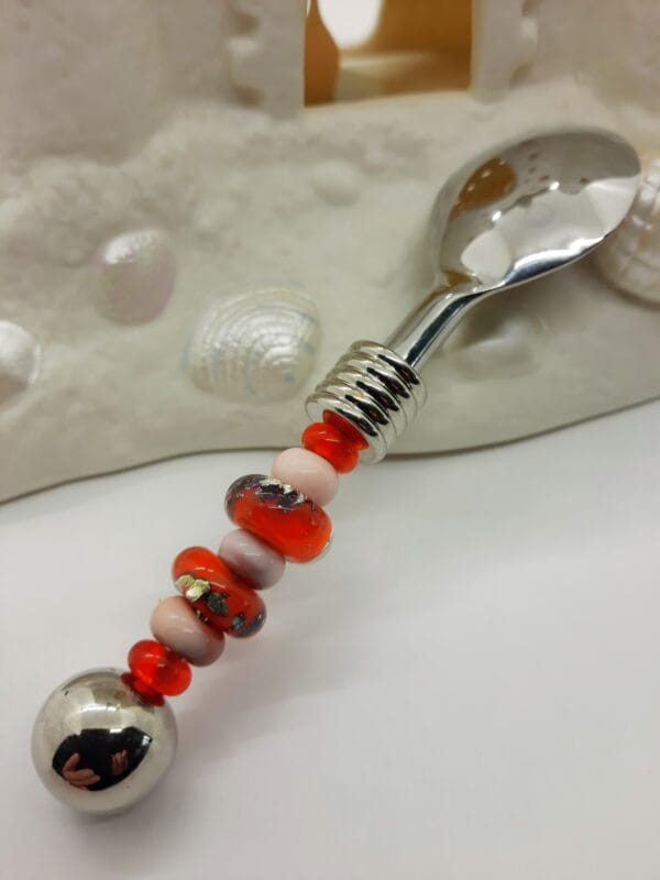 Orange foil and coral jelly spoon