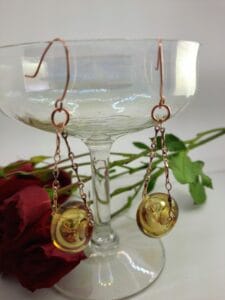Pale ale hollow copper GG dangly earrings