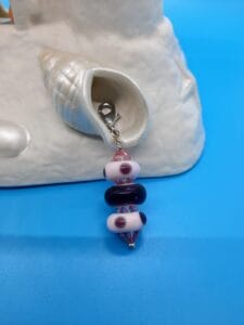 Purple polka dot zipper pull