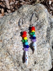 Rainbow on white drips dangly earrings
