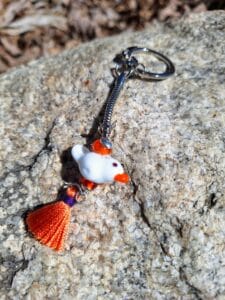 White dove with orange keychain