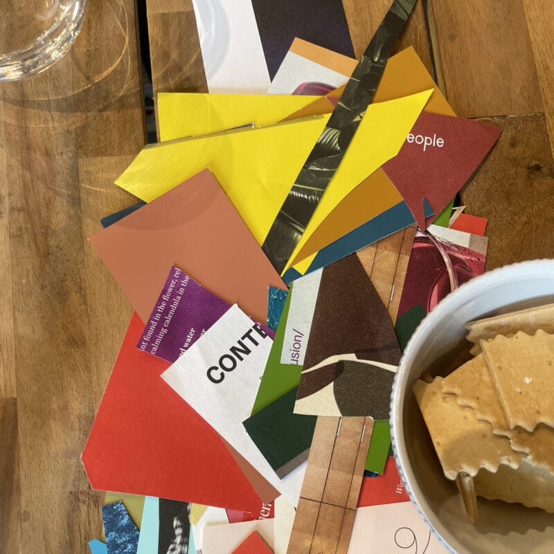 Colorful paper scraps used in a previous collage workshop